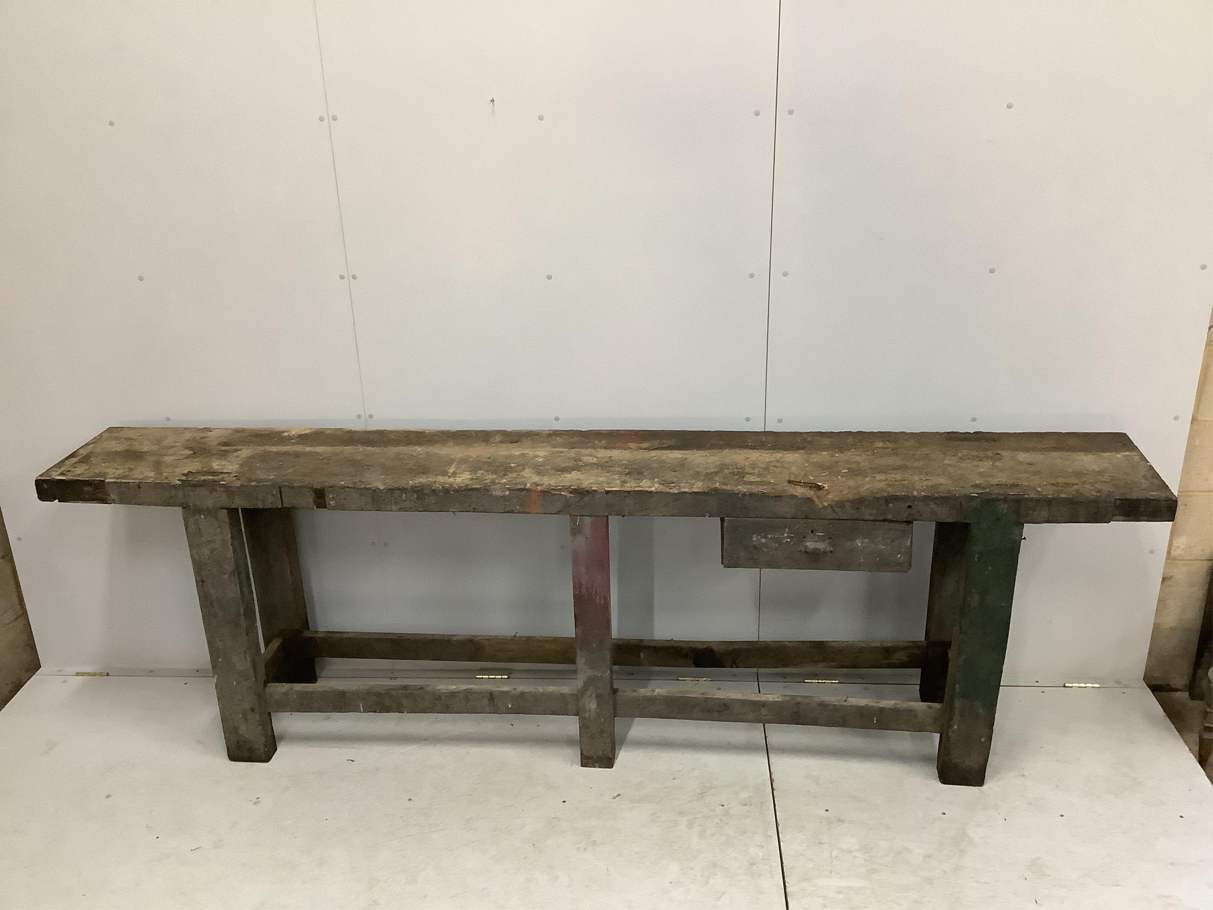 A 19th century Provincial work bench, fitted drawer, width 295cm, depth 40cm, height 90cm. Condition - poor